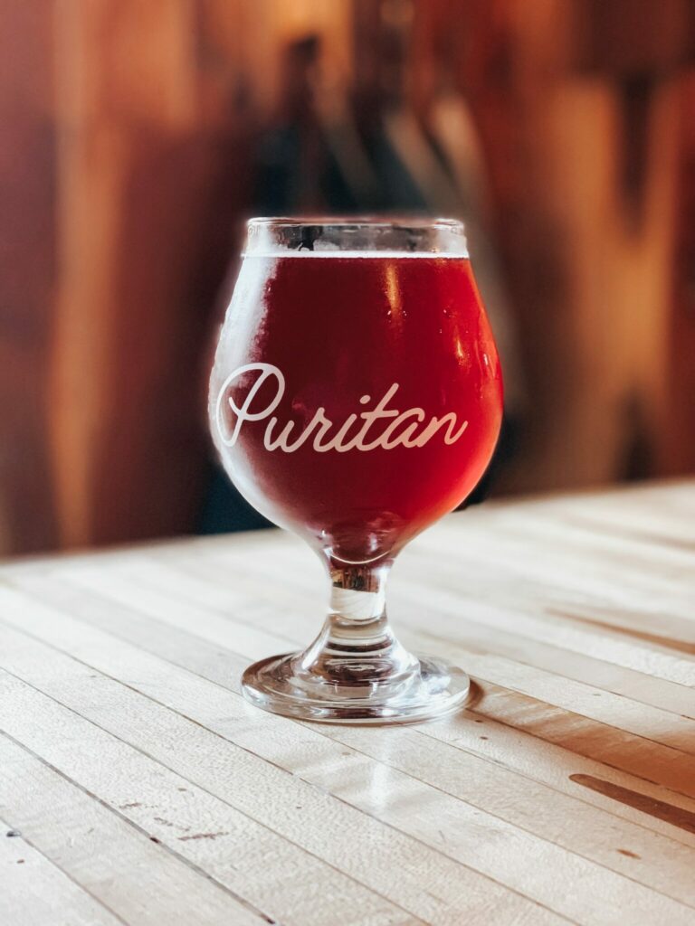 the new puritan: drinking glass image